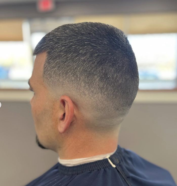 Buzz cut with sharp part line